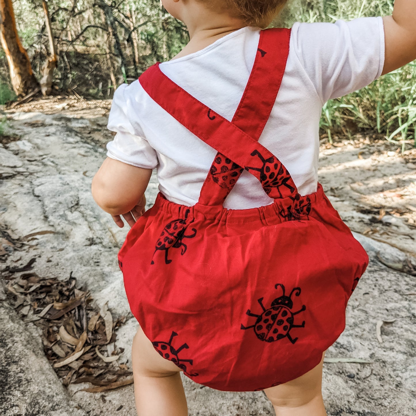 Back View Toddler Wearing Ladybug Romper