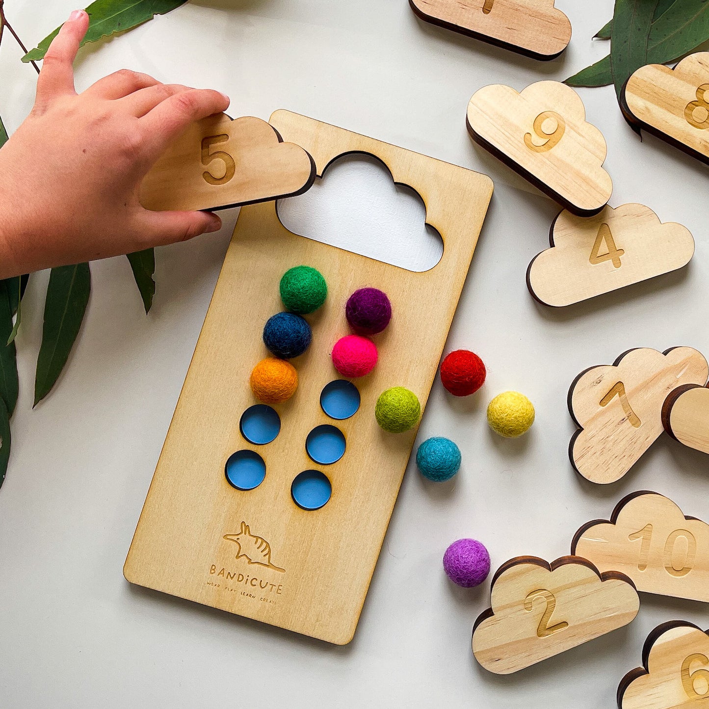 Child using 10 frame counting board