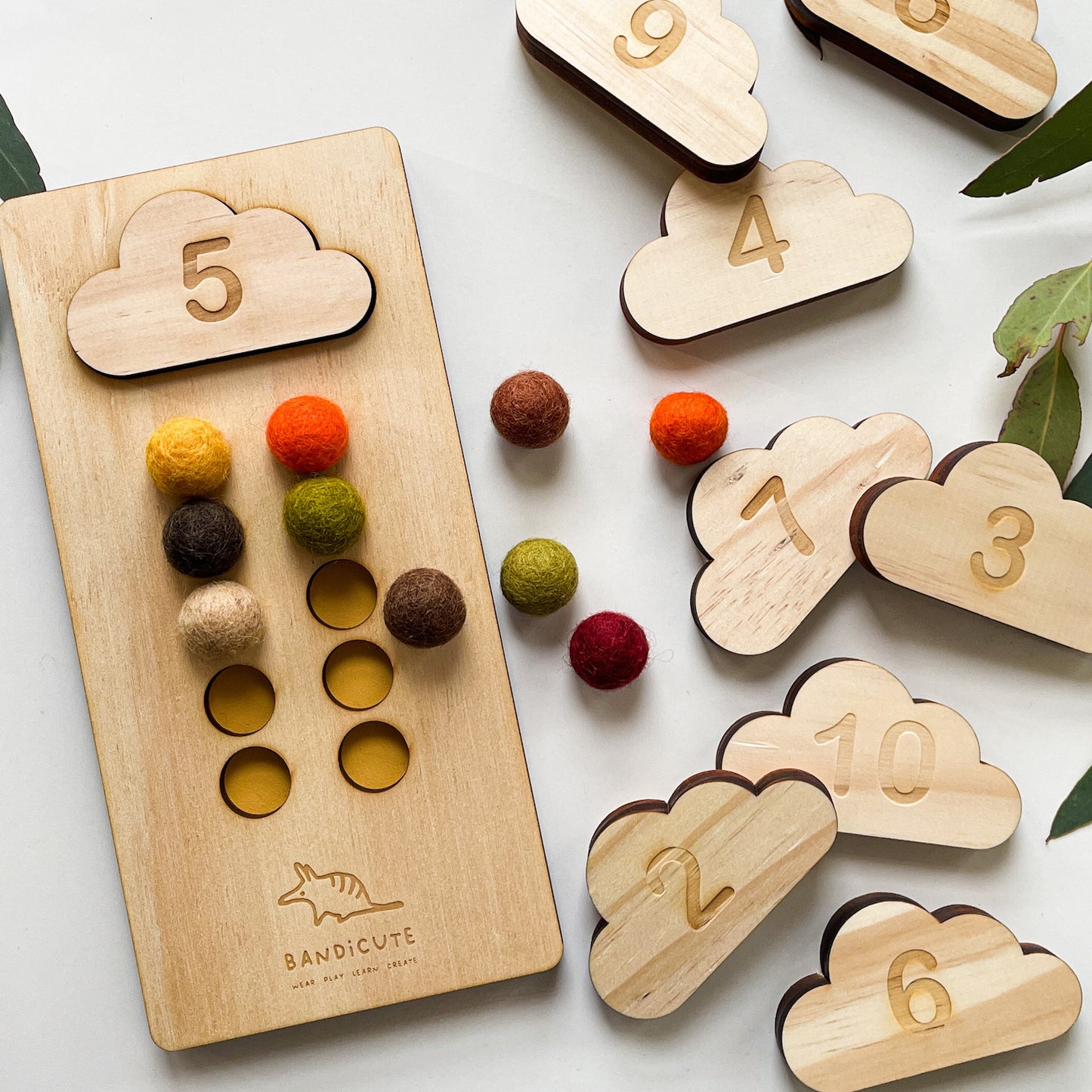 Detail ten frame counting board with earthy coloured felt balls