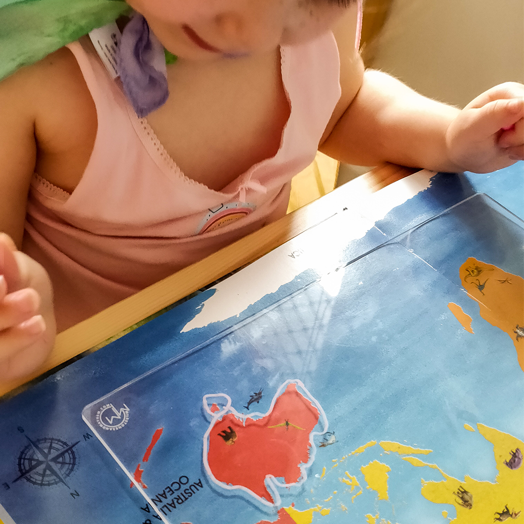 Child using acrylic tracing board for tracing