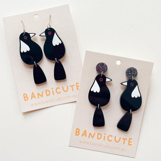 Mini magpie dangle earrings. 3mm black acrylic with white painted features.